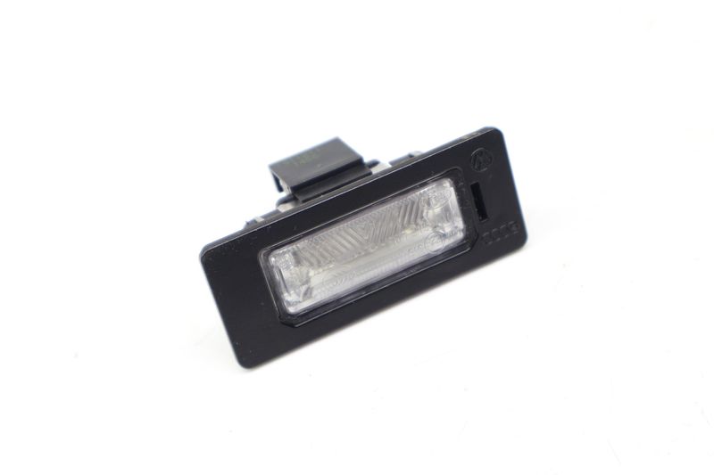 License Plate Light 8T0943021 — Used (SKU 724827)