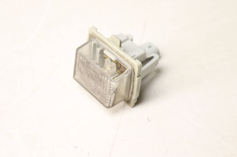 License Plate Light 2218200856 — Used (SKU 553157)