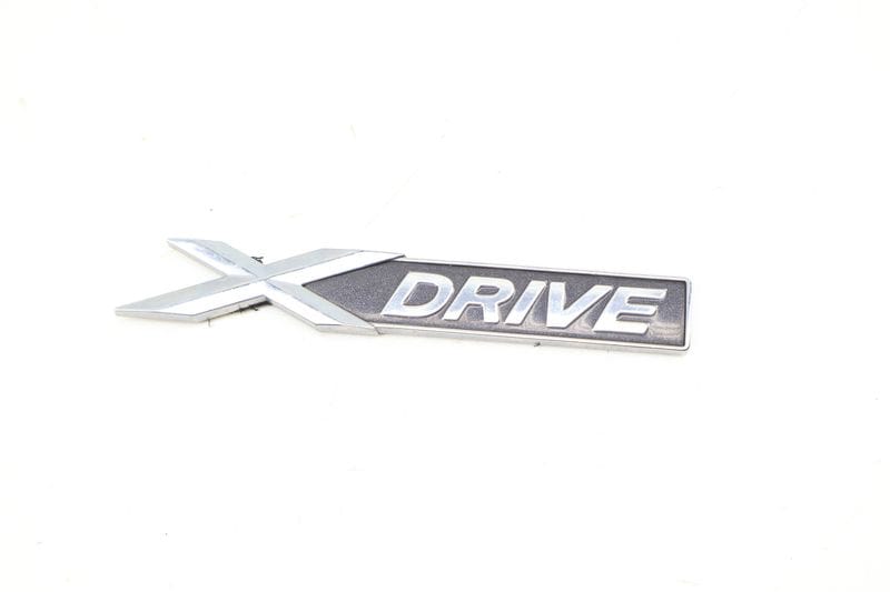 Emblem / Badge (XDRIVE) 51147318576 — Used (SKU 690524)