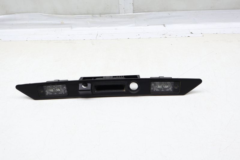 Trunk License Plate Light / Handle Assembly 4E0827574M — Used (SKU 668348)