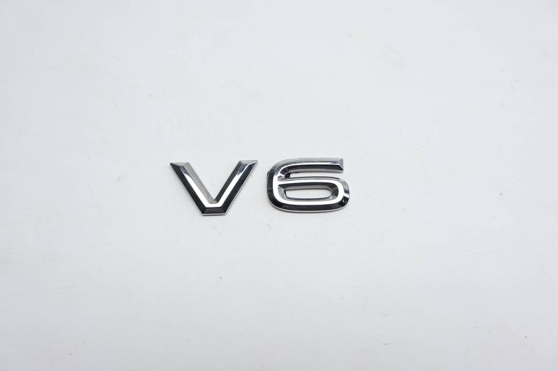 Trunk / Hatch Emblem / Badge (V6) 760853675 — Used (SKU 716663)
