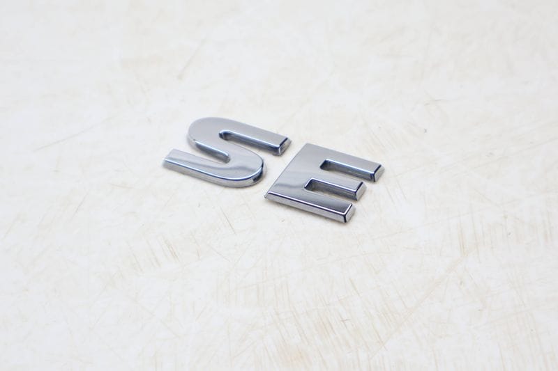 Trunk Emblem / Badge (SE) 5NN853687A — Used (SKU 672659)