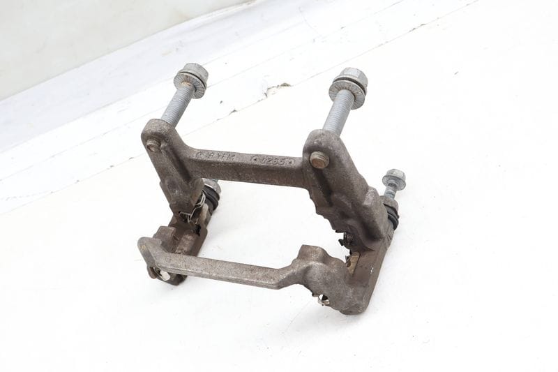 Brake Caliper Carrier / Bracket 80A615426D — Used (SKU 670476)