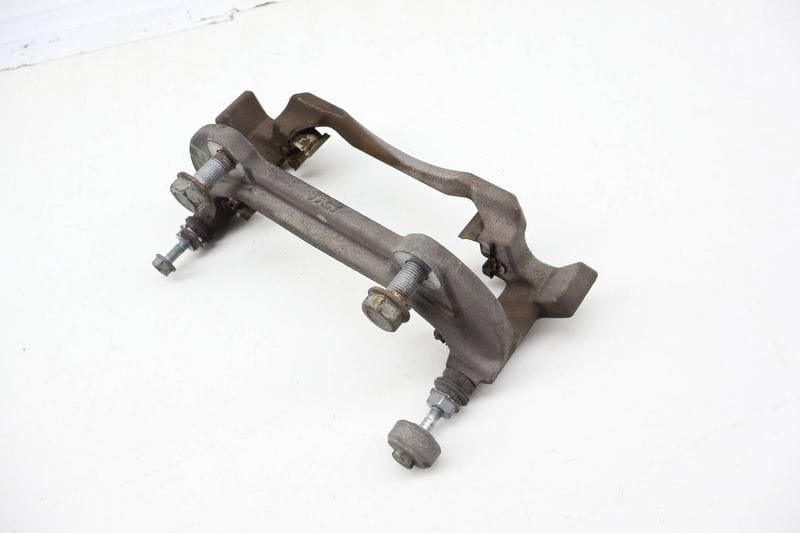 Brake Caliper Carrier / Bracket 3QF615125A — Used (SKU 723559)